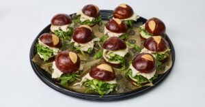 tray of Fat Shallot turkey sandwiches on pretzel buns